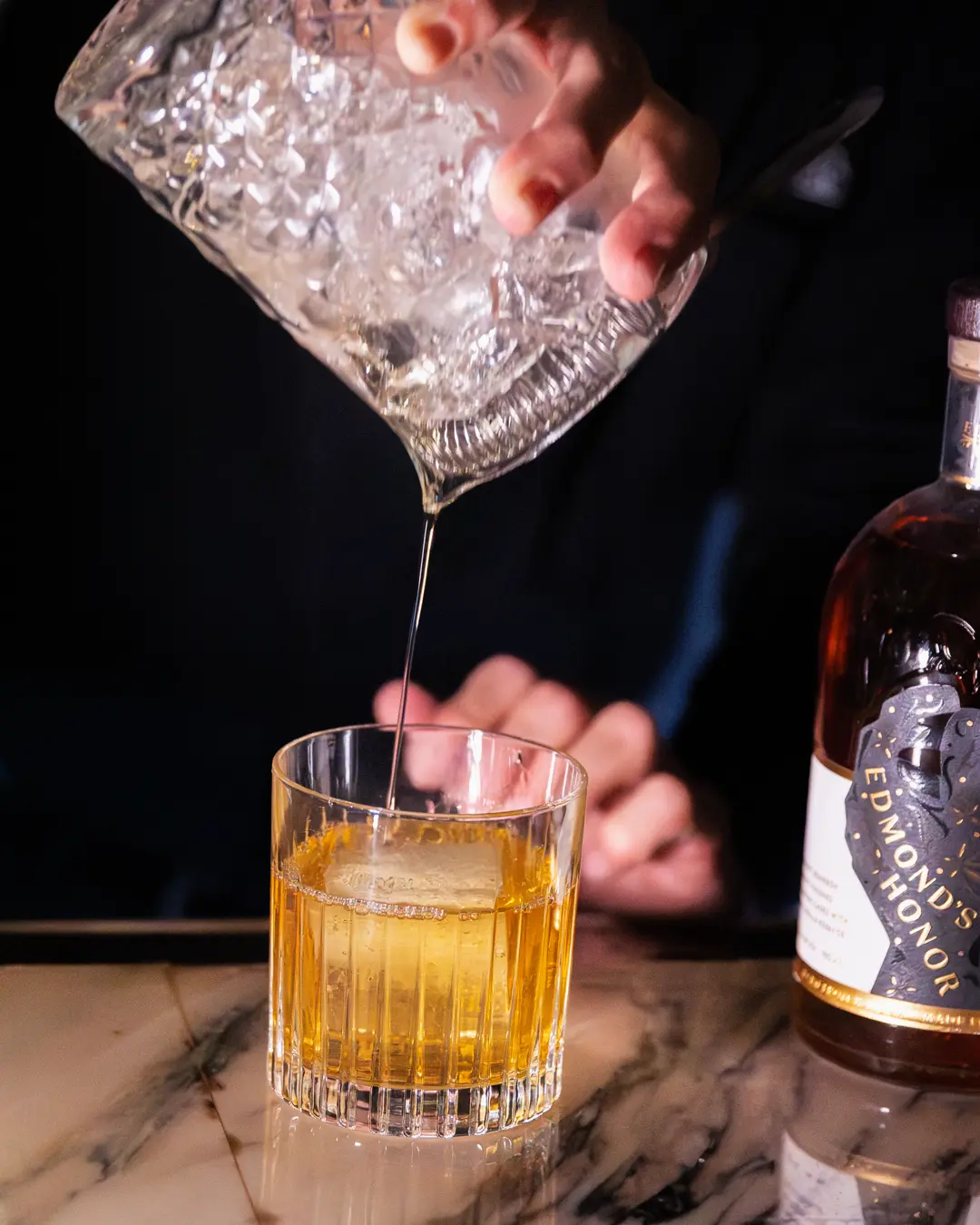 An Edmond's Honor cocktail poured at the bar